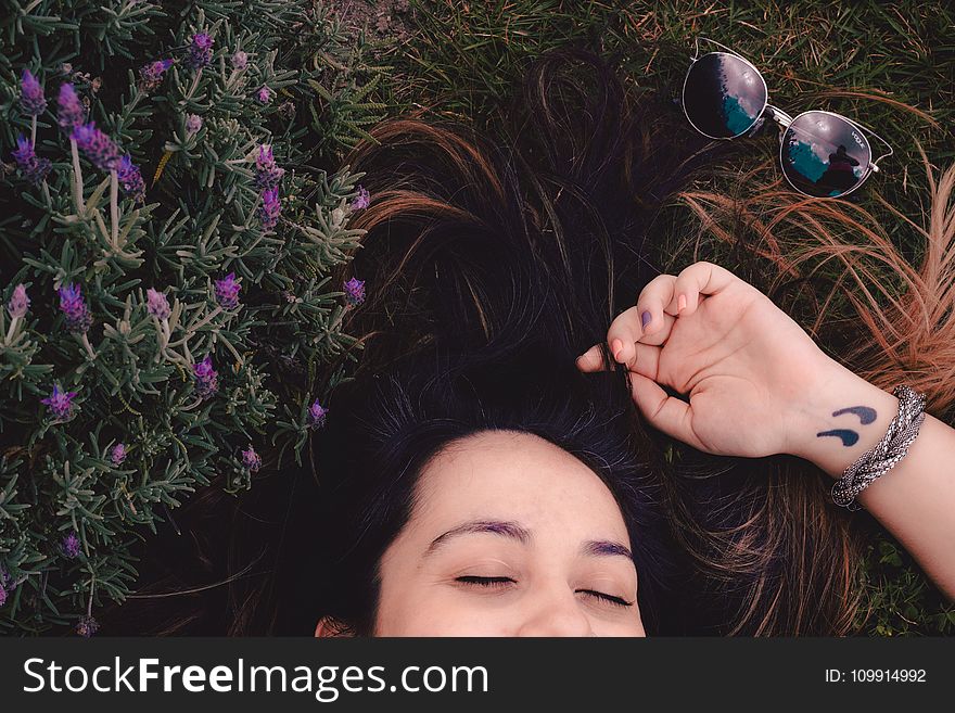 Woman Lying on Flower Field