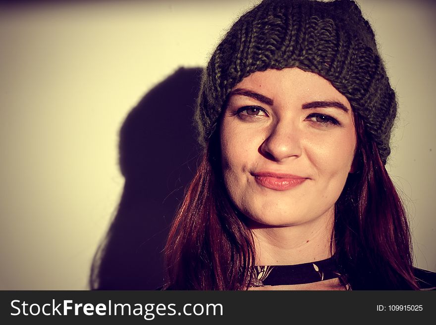 Brown Haired Woman Wearing Black Knitted Hat