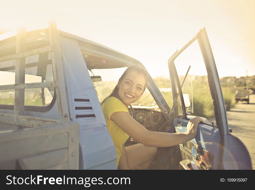 Woman Peeking Inside the Pickup Truck