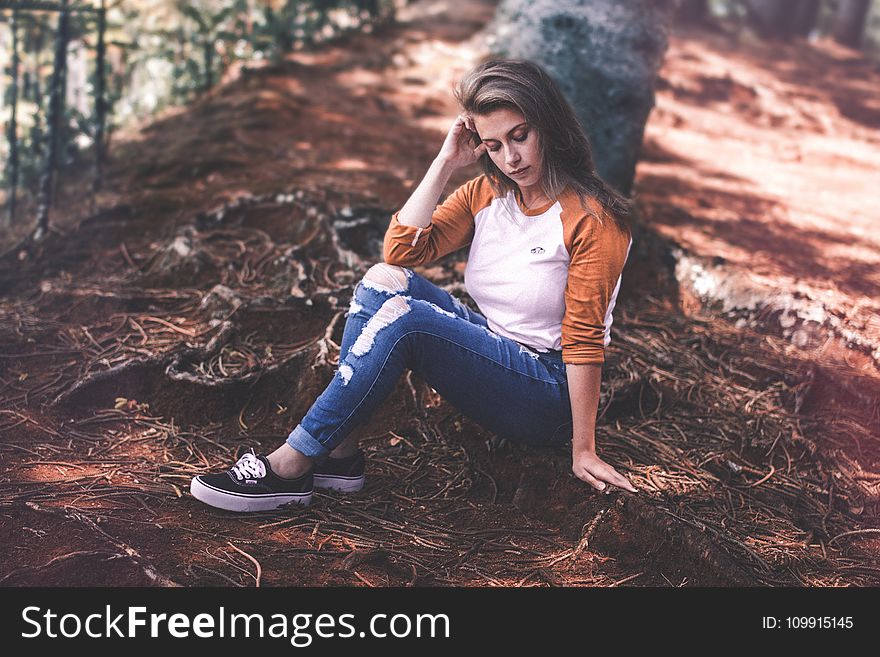 Woman Sitting On Ground