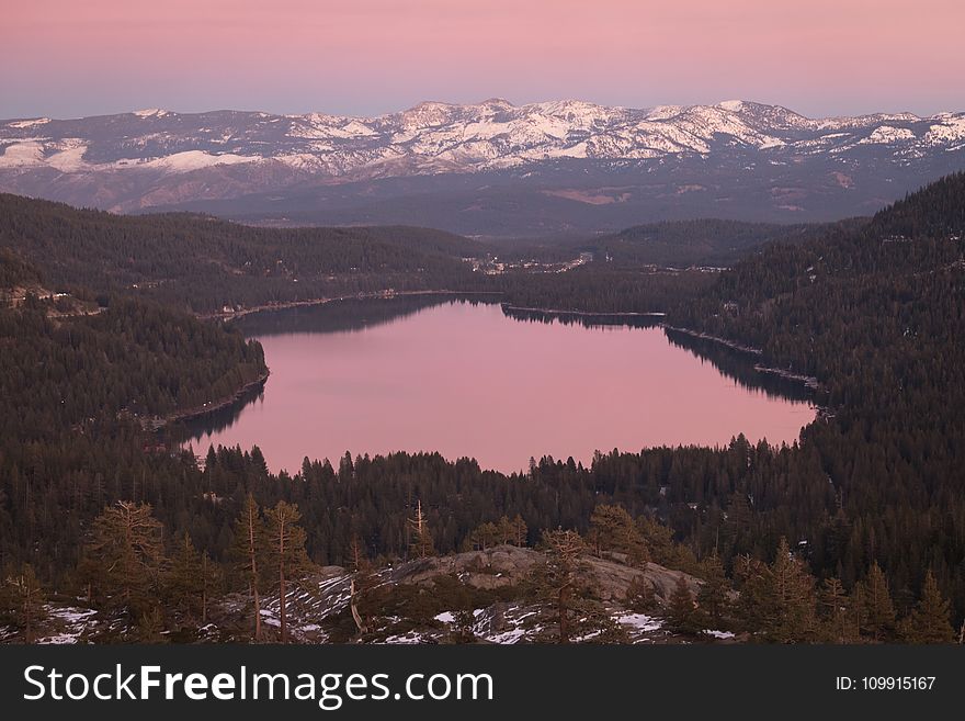 Aerial Photography Of Lake Surrounded By Trees During Golden Hour