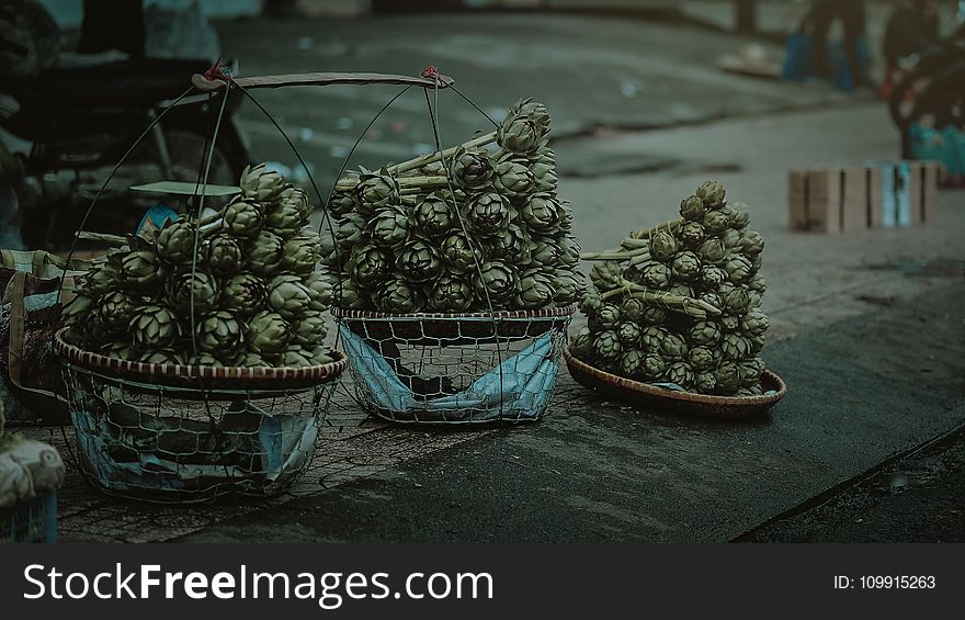 Gray Nuts With Three Baskets on Gray Table