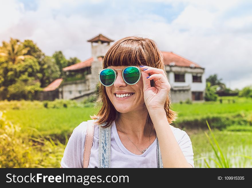 Woman Wearing Green Sunglasses