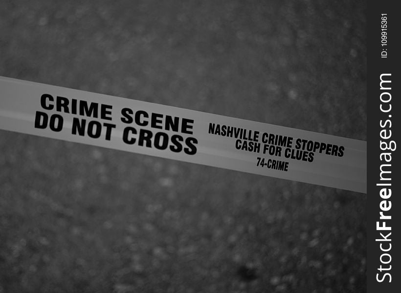 Grayscale Photo of Crime Scene Do Not Cross Tape