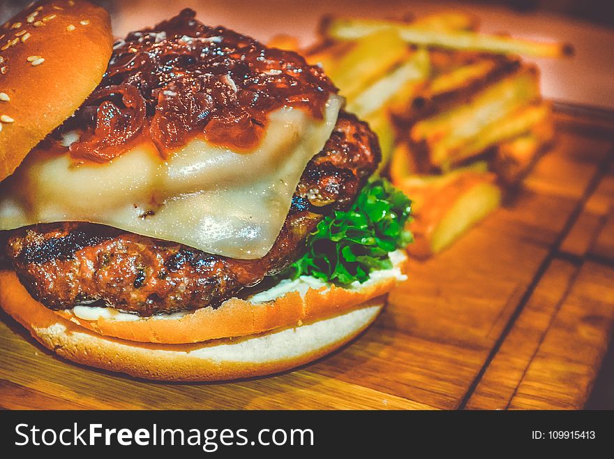 Selective Focus of Ham Burger on Wooden Surface Photo