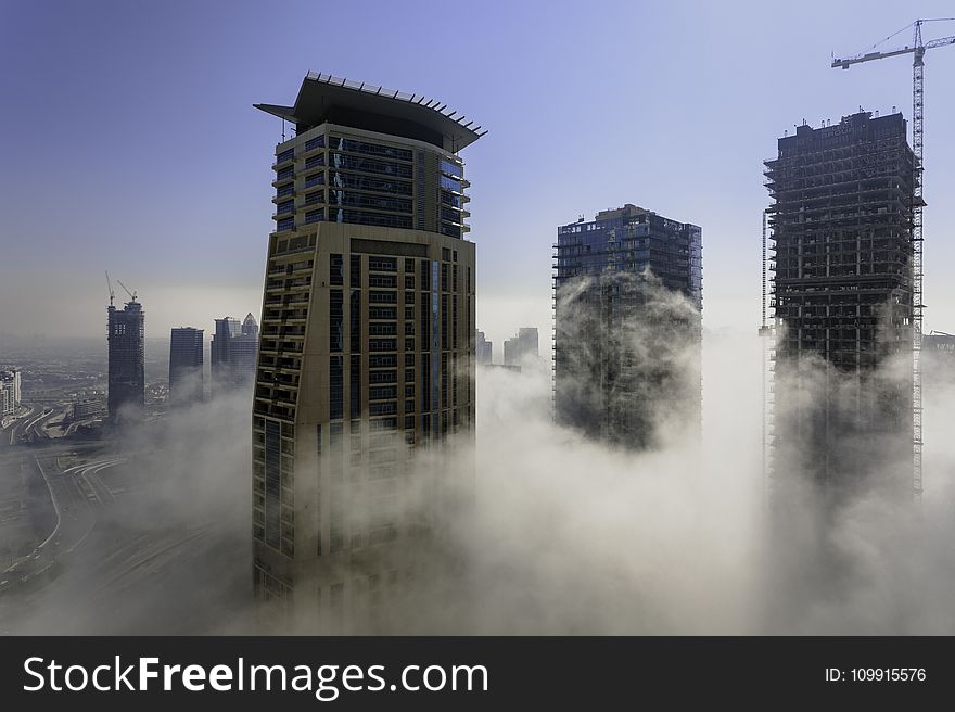 Three Brown High Rise Buildings