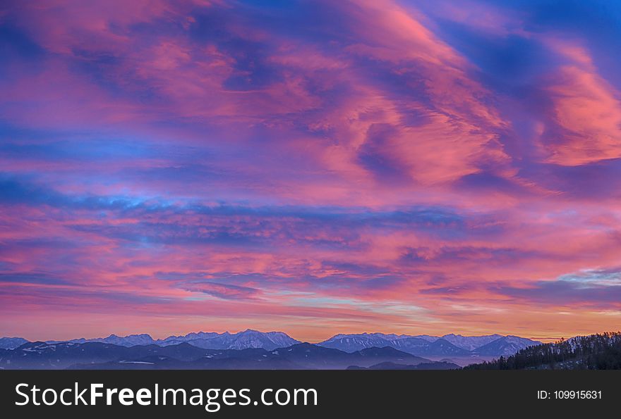 Snow Cap Mountain Under Nimbus Clouds