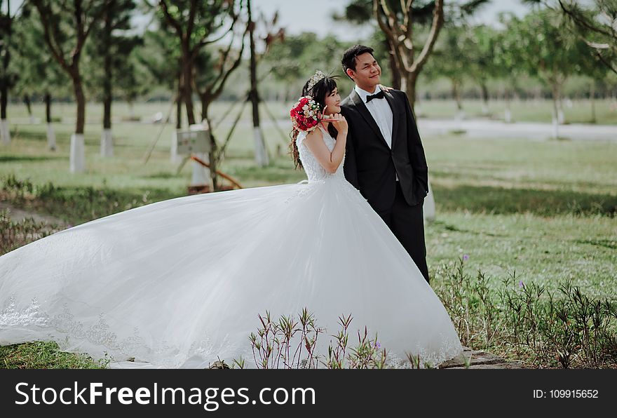 Newly Wed Couple Surrounded by Trees