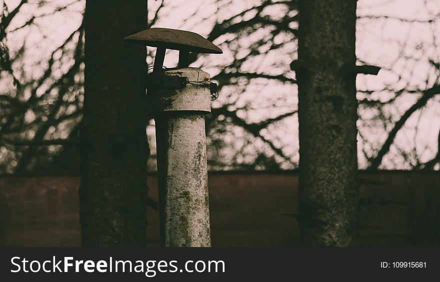 Selective Photography of White Metal Pole