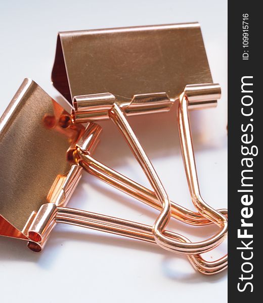 Two Gold Binder Clips