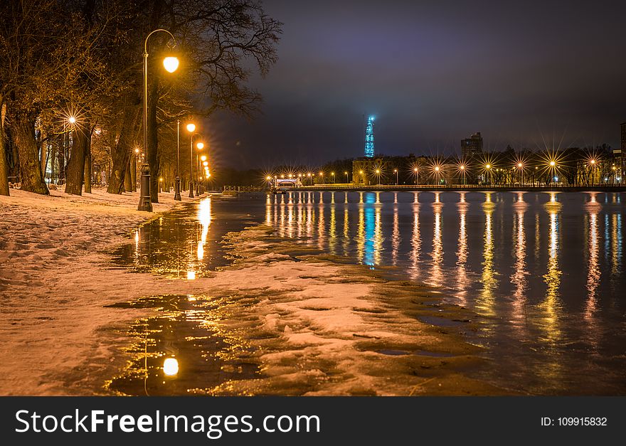 Photography Of Street Light On Seashore