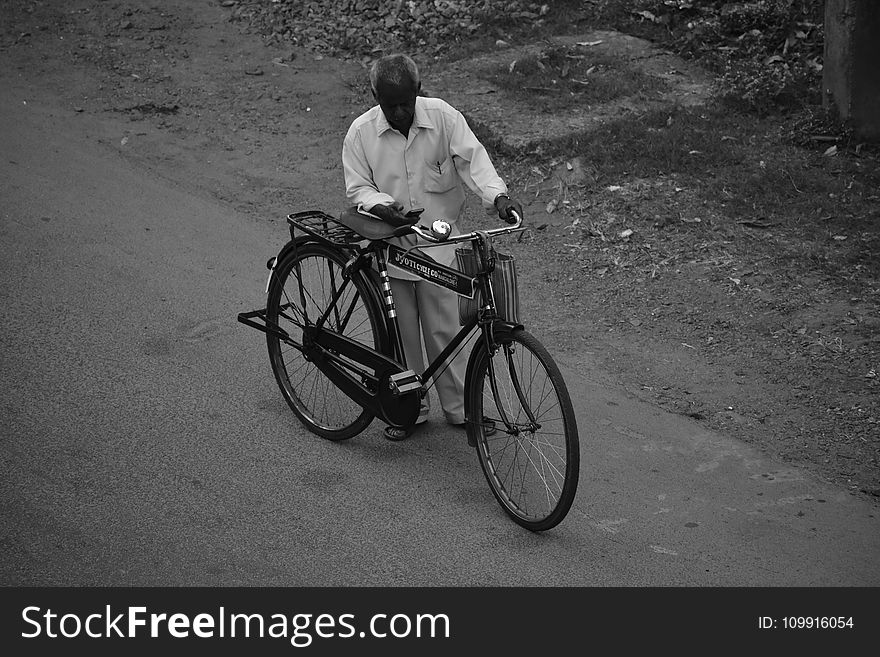 Man Beside Bicycle