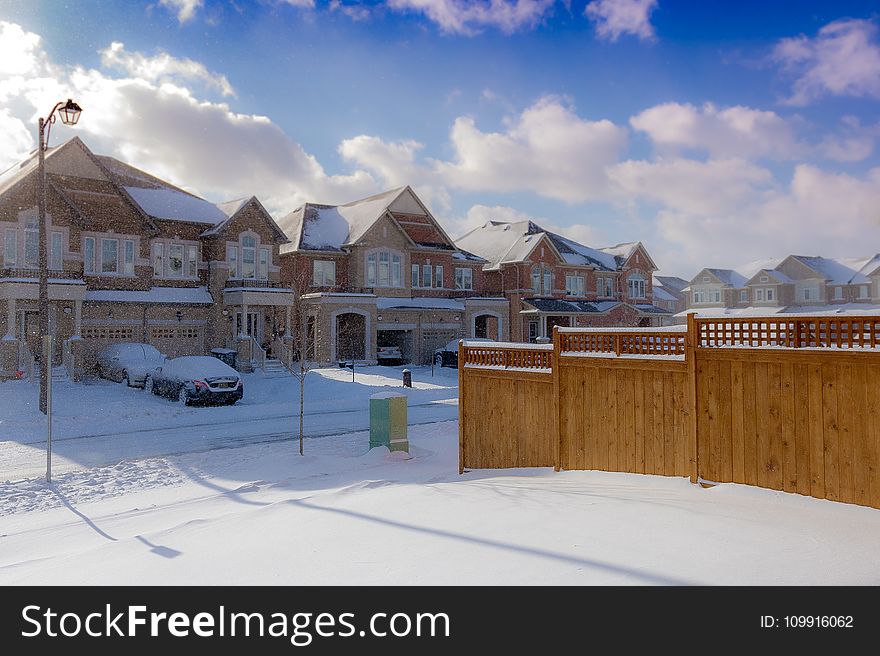 Brown 2-storey Houses during Snow