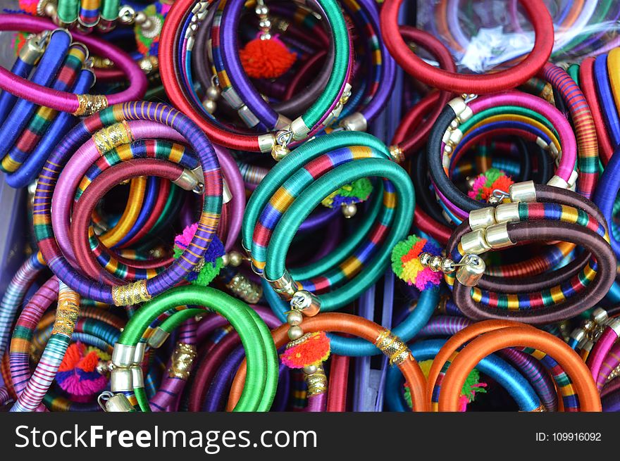 Pile Of Women&x27;s Assorted Colored Bangles