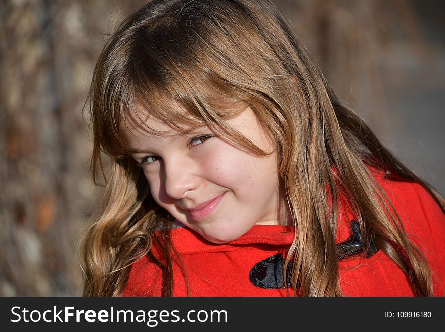 Blonde Girl Wearing Red Toggle Jacke