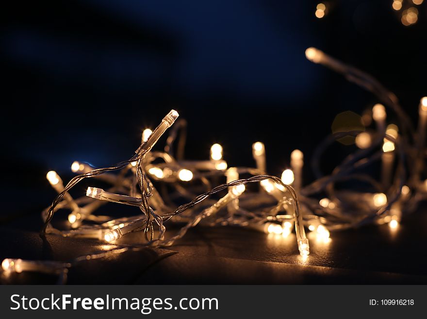 Selective Focus Photo of White and Yellow String Lights