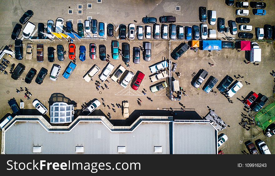 High-angle Photo of Vehicles Parked Near Building