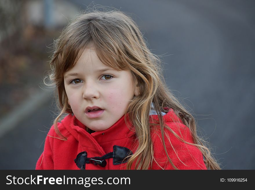 Blonde Girl Wearing Red Toggle Jacket