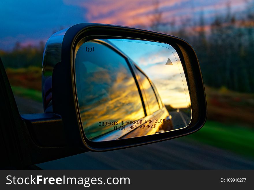 Selective Focus Photography of Vehicle Side Mirror