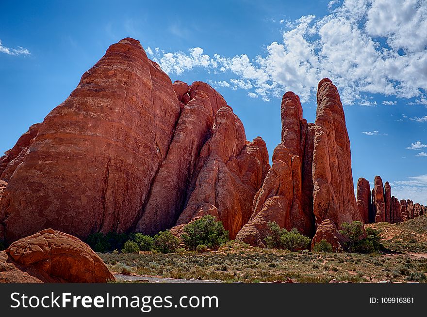 Brown Stone Formation Under Blue Skies At Daytime