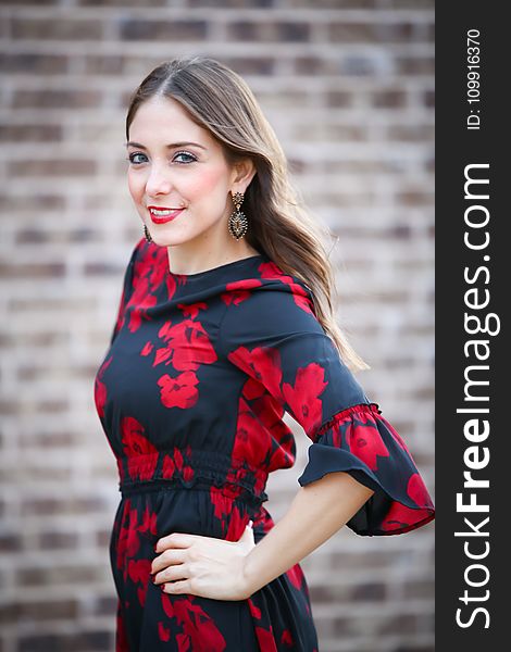 Woman in Black and Red Floral Half-sleeved Dress