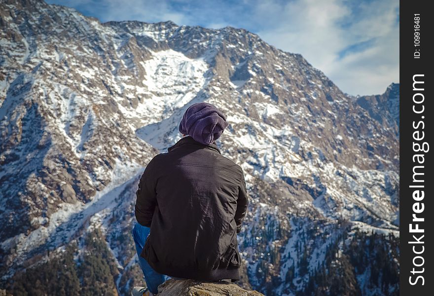 Person Sitting on Hill