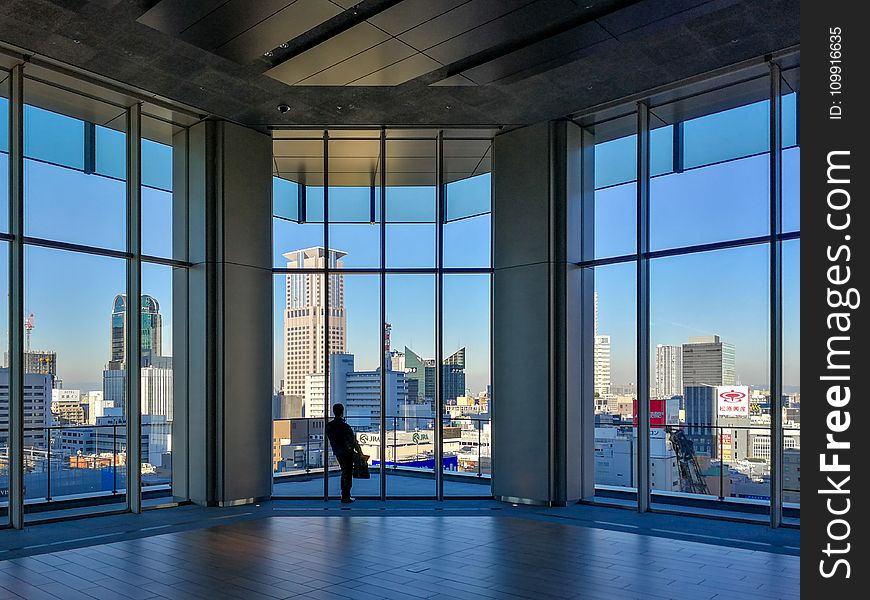 Person Inside Clear Glass Room