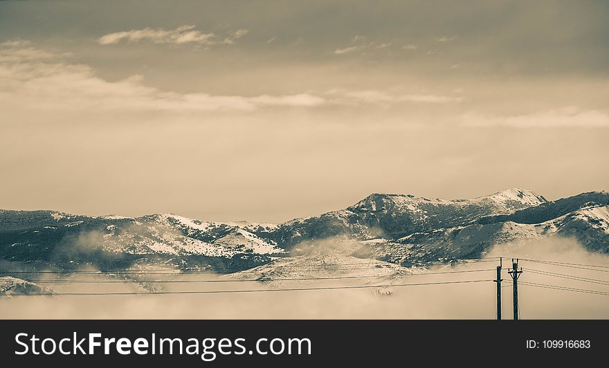 Cable Wires in Front of Snow Covered Mountains