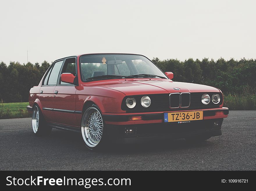 Photography Of Red BMW On Asphalt Road