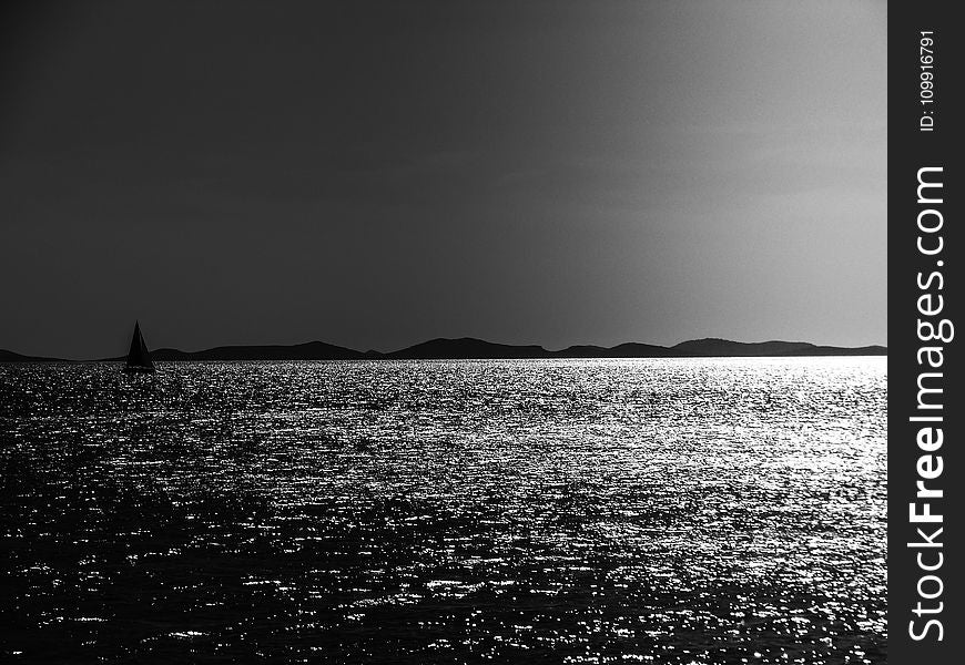 Grayscale Photo Of A Body Of Water