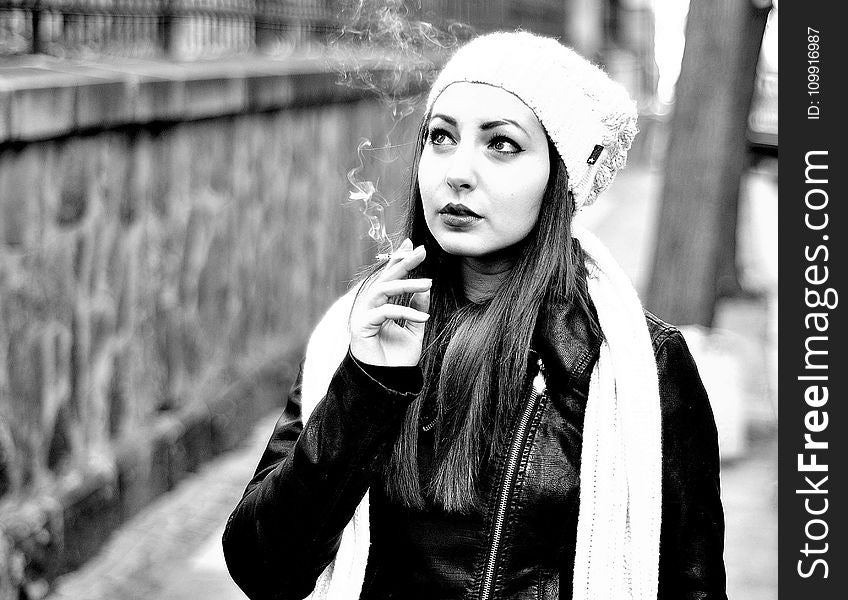 Grayscale Photography Of Woman Smoking