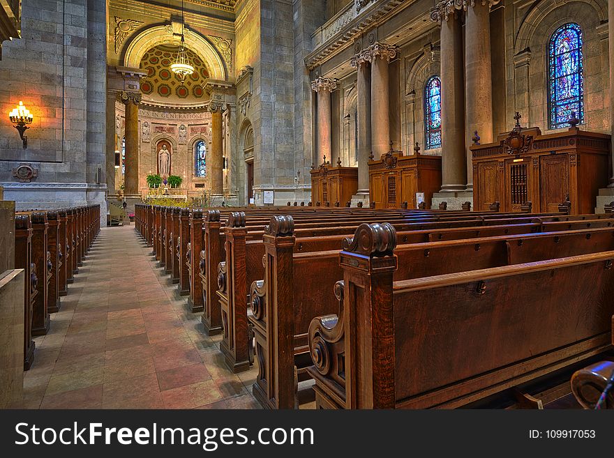 Brown Wooden Church Pew Align Facing the Altar