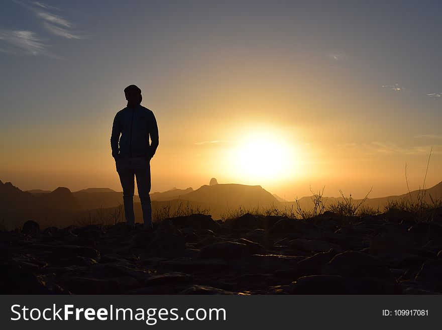 Person Taking Photo In Sunset