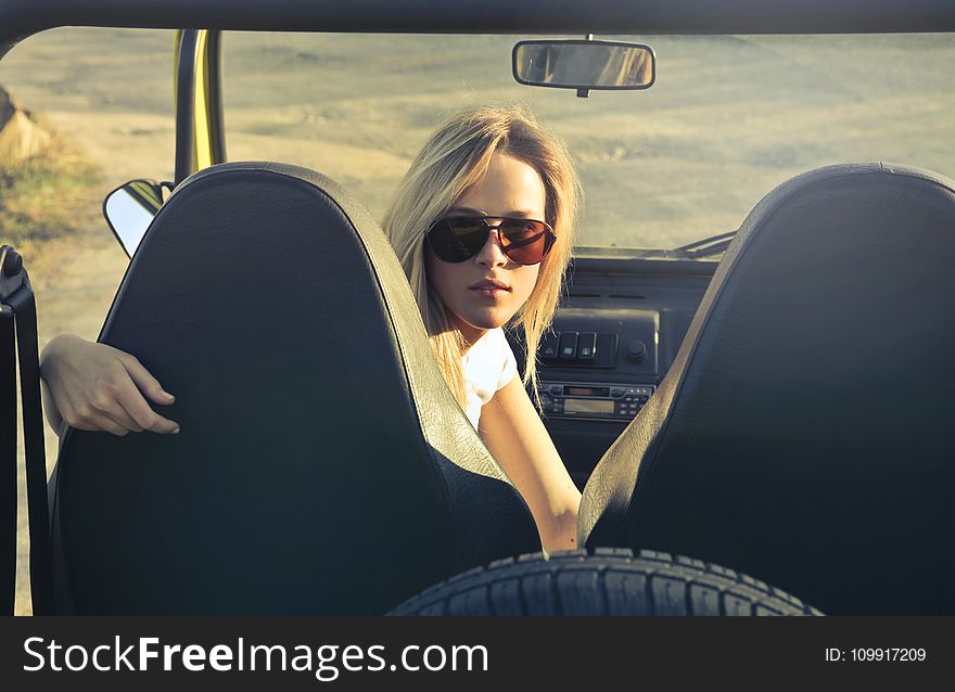 Woman Wearing Sunglasses Riding in Car