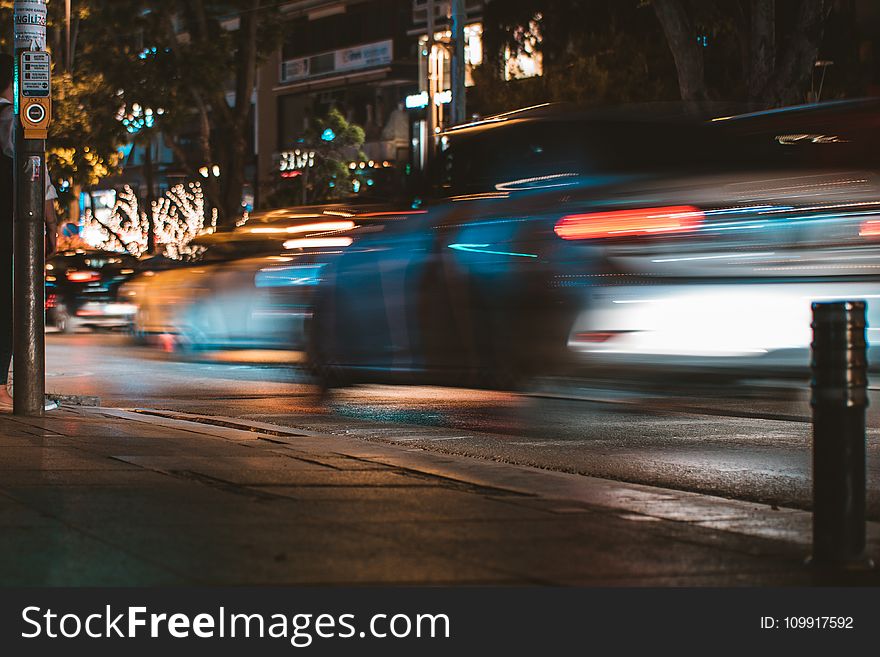 Time-lapse Photography of Silver Car Passed by on Road