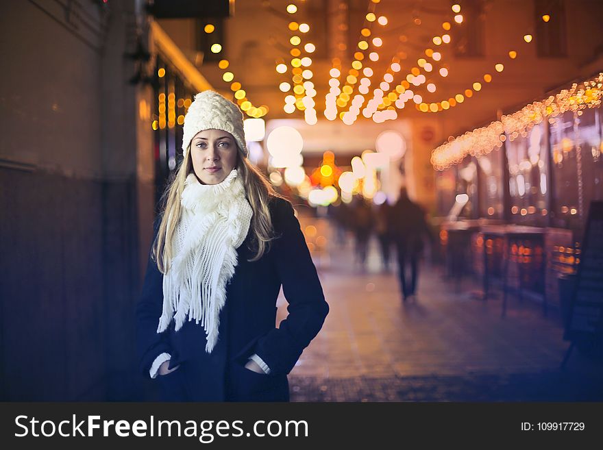 Woman In Black Long-sleeved Top With White Scarf