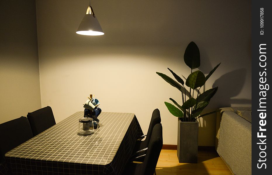 Photo of Dining Table near the Plant