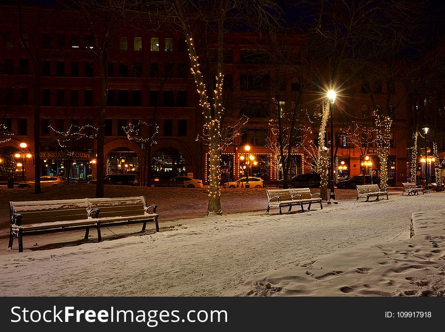 Photo of Snow Covered Benches in the Street