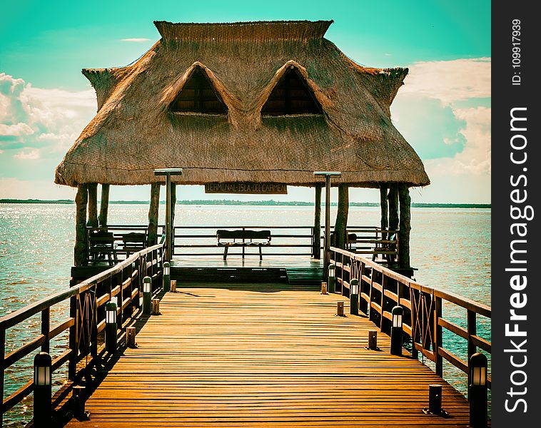 Brown Wooden Hut On Pier