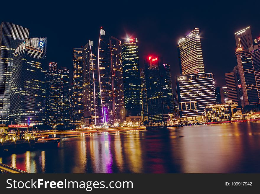 Photography Of High-Rise Building At Night Time