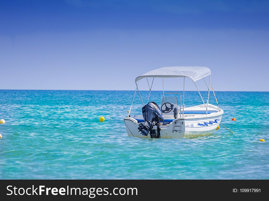 White Bow Rider Parked On The Body Of Water