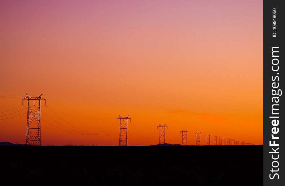 Photo of Electric Posts During Sunset