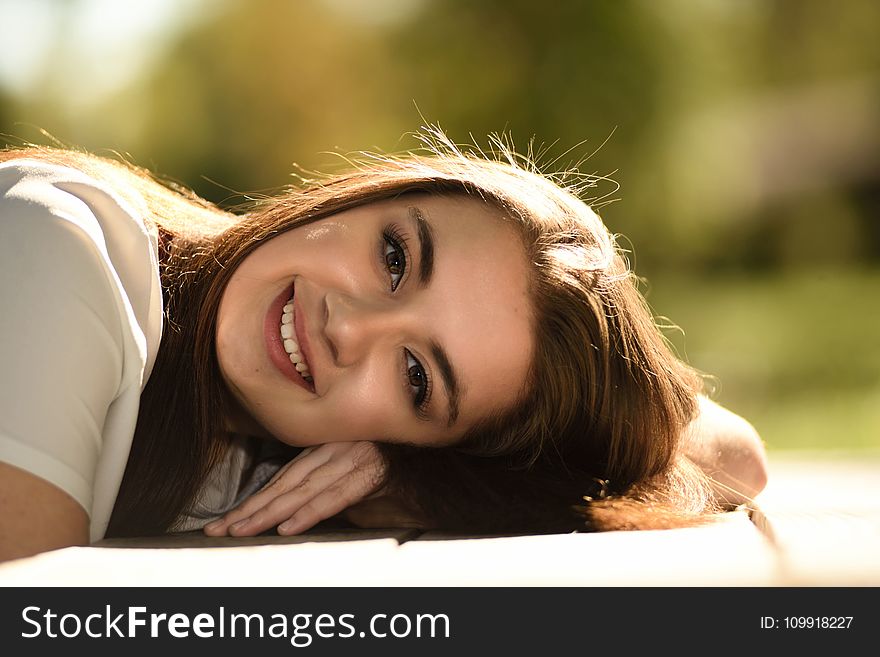 Close Up Photography of Woman Laying on Table