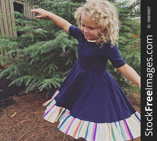 Photo of Girl Wearing Half-sleeved Dress Near Green Leaf Plant