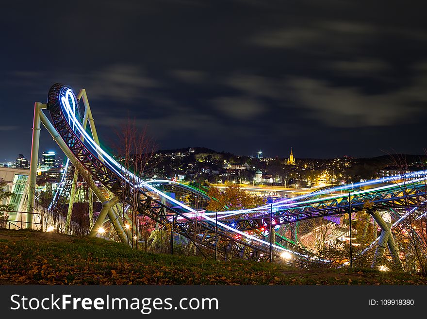 Time-lapse Photography Of Roller Coaster During Night Time