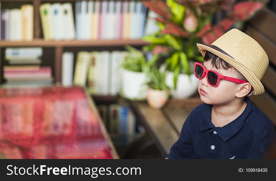 Photography of a Boy Wearing Sunglasses