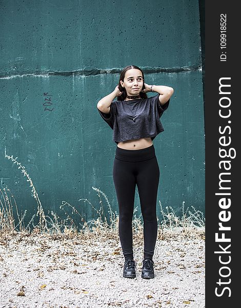 Woman Wearing Black Crew-neck Crop-top and Black High-waist Fitted Leggings