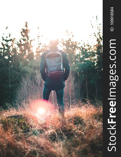 Man Standing Infront Of Forest