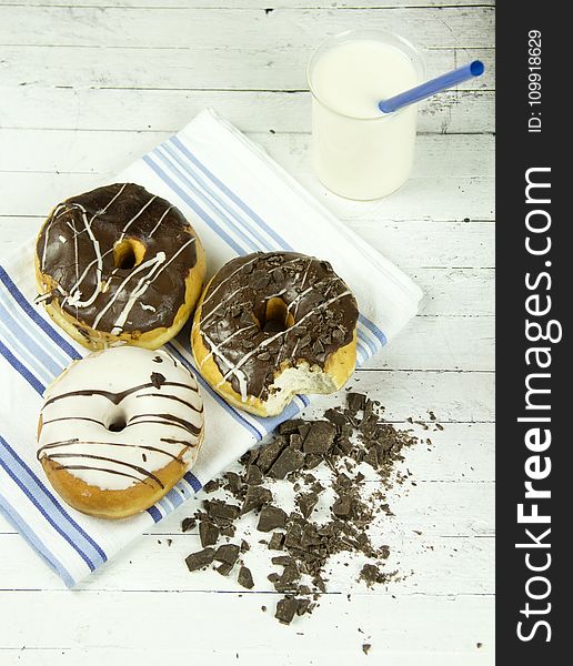 Three Assorted Donuts With Milk