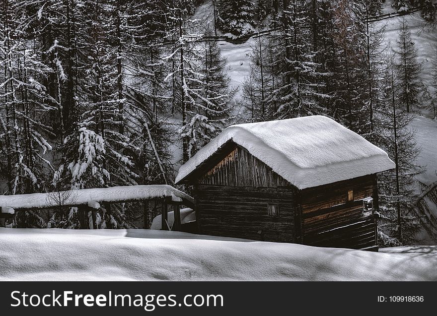 Brown Wooden Barn during Snow